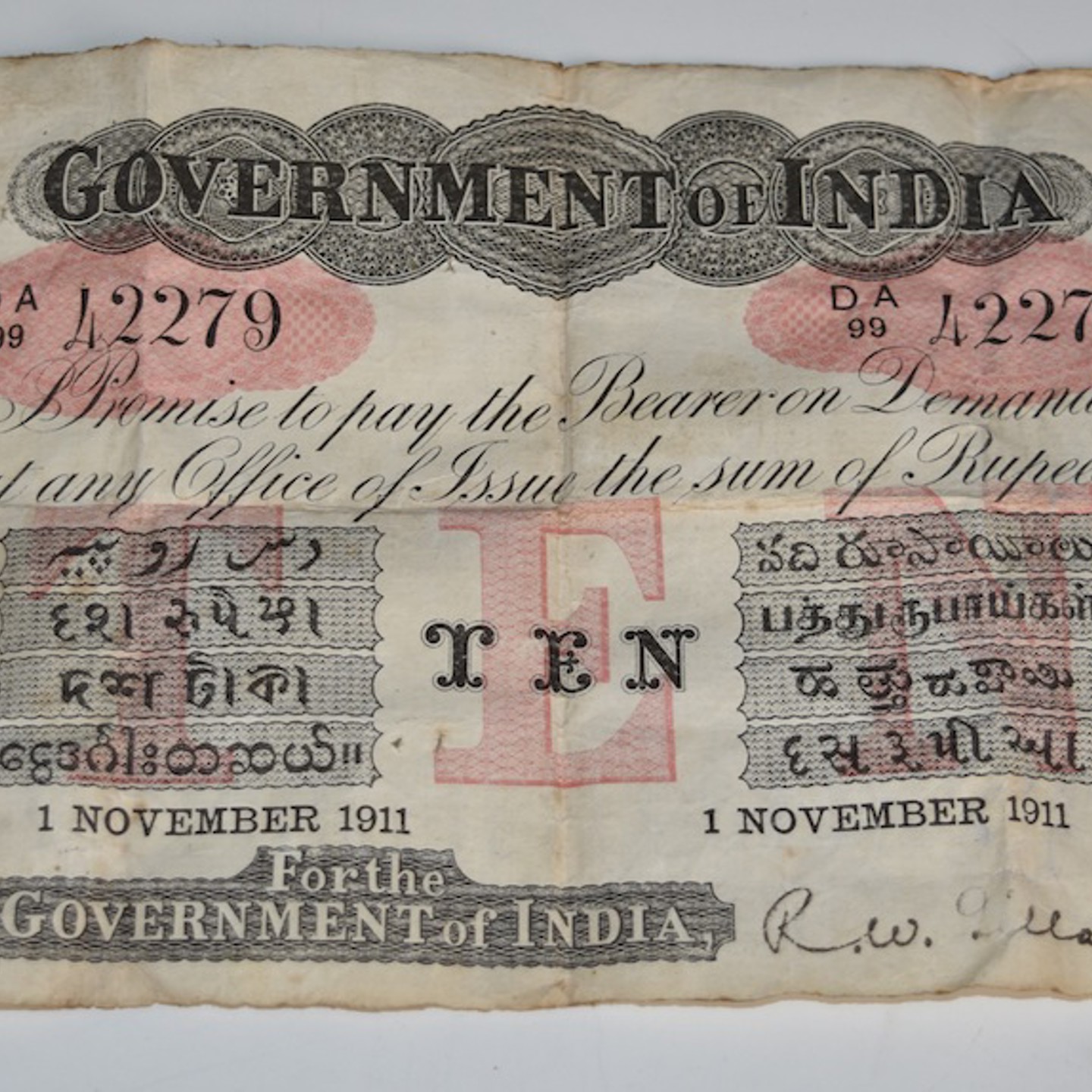 Government Of India 10 Rupees, Letter 'A' For Cawnpore, 1 November 1911, Serial Number AD99 42279, Signature R. W. Gillan, Black On Red Underprint. Sold For Ś2,800