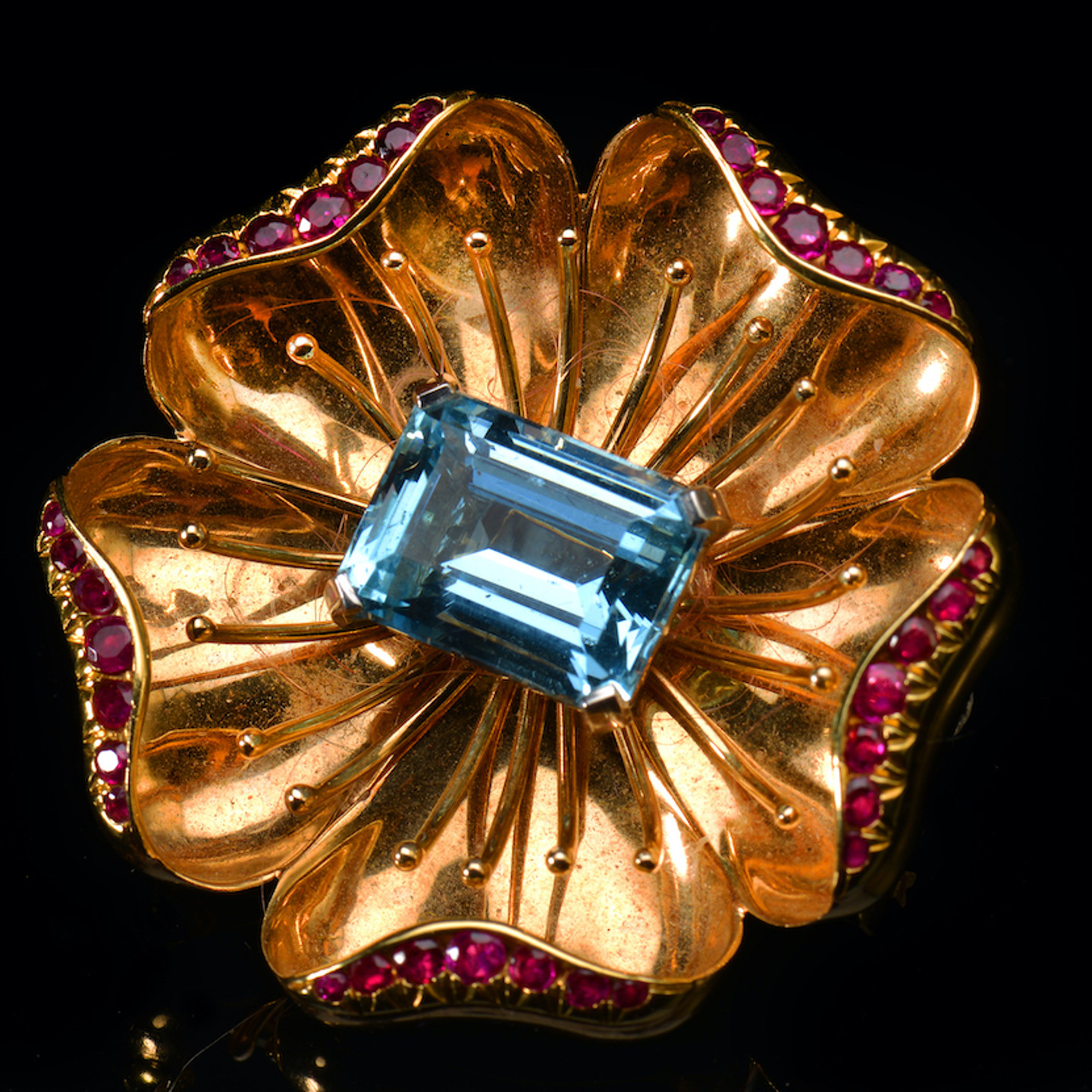 A Tiffany & Co Brooch In The Form Of A Flower Set With A Central Emerald Cut Aquamarine. Sold For £2000