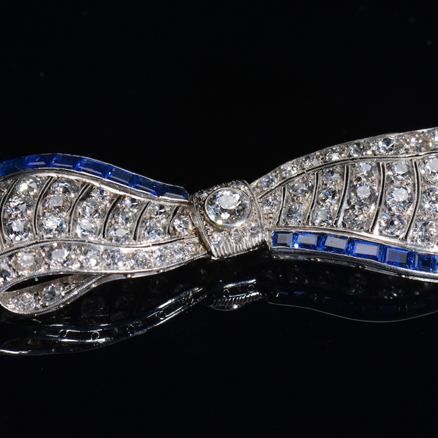 An Exceptional Art Deco Platinum Brooch In The Form Of Bow Set With Diamonds And Sapphires. Sold For £3,000