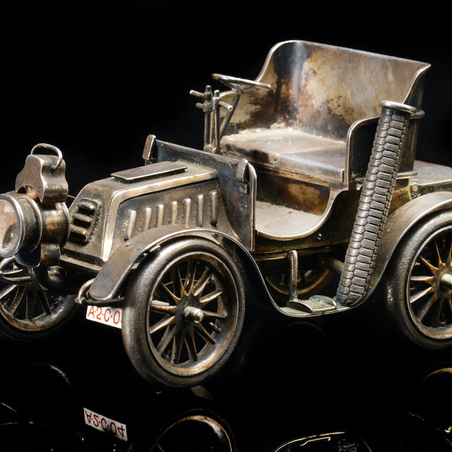 An Edward VII Novelty Hallmarked Silver Table Lighter Formed As A Veteran Car, London 1903, Length 14Cm. Sold For £3,300