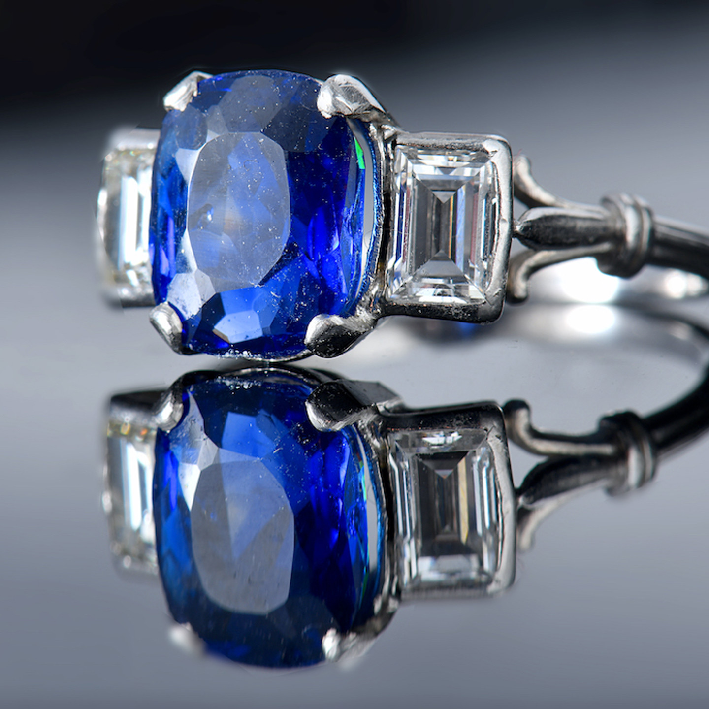 A Platinum Ring Set With A Cushion Cut Sapphire Of Approximately 3.1Cts. Sold For £4,600