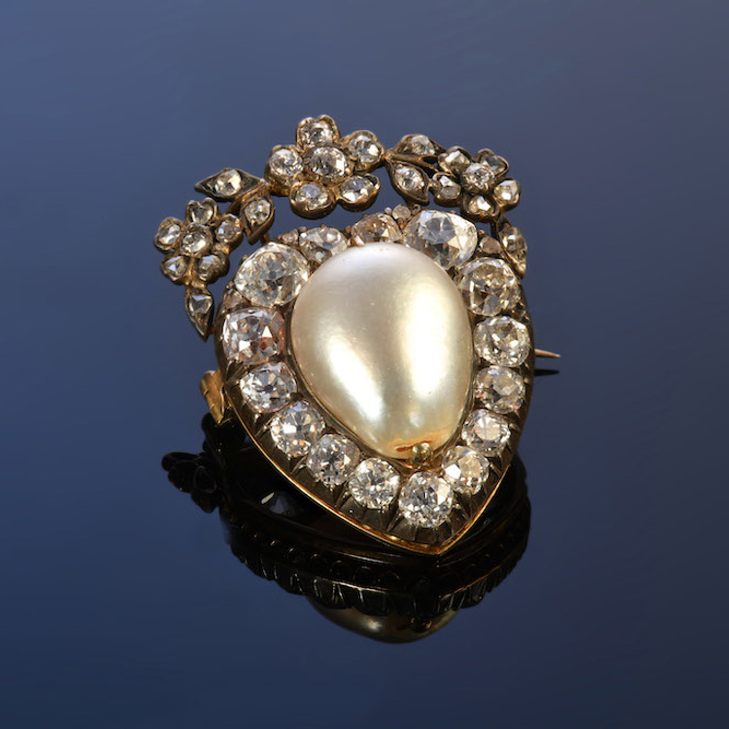 Victorian Brooch In The Form Of A Heart Set With A Large Natural Pearl Surrounded By Diamonds. Sold For £8400