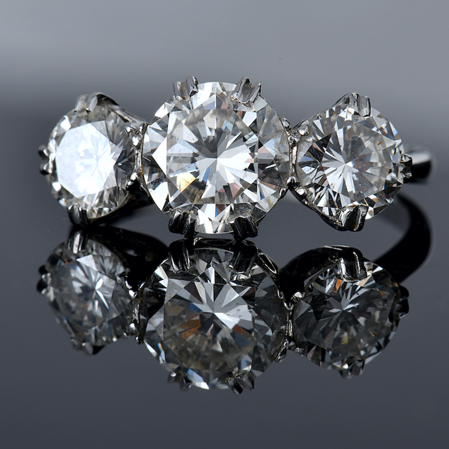 A Platinum Ring Set With Three Round Brilliant Cut Diamonds. Sold For £11,500