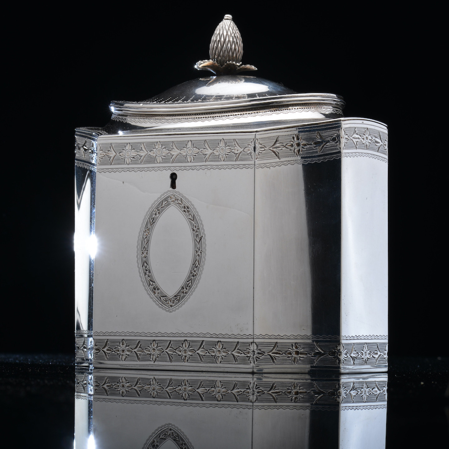 A Georgian Hallmarked Silver Tea Caddy, Of Neoclassical Form With Incuse Corners, Shaped Lid And Bright Cut Decoration, London 1790, Maker John Robins Sold For £950