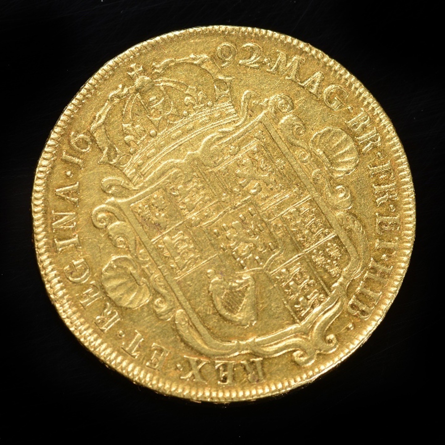 A 1692 William And Mary Gold Five Guinea Piece, Near VF. Sold For Ś8,400