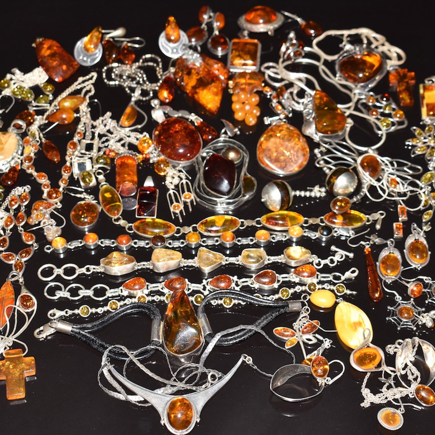 A Collection Of Silver Set With Pressed Amber. Sold For £750