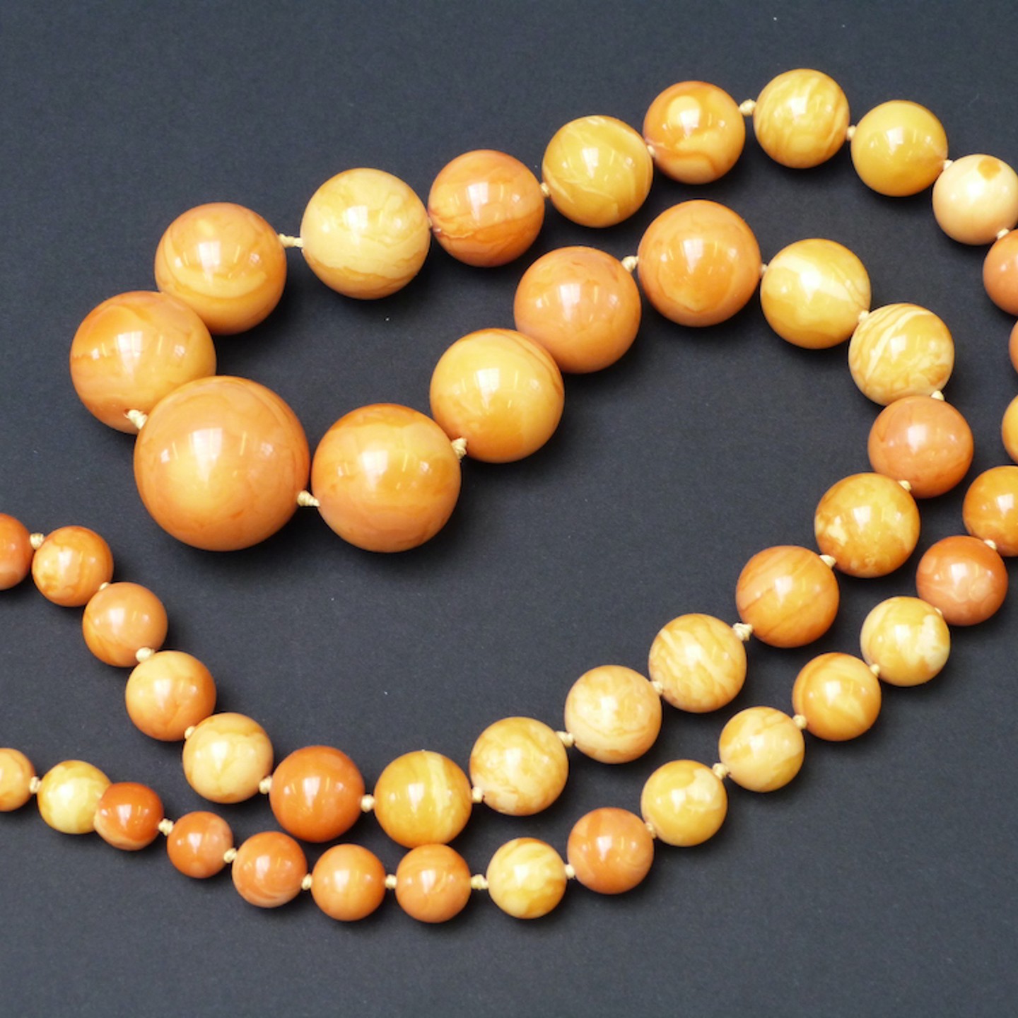 A Large Amber Necklace Of 49 Spherical Beads Sold For £5200
