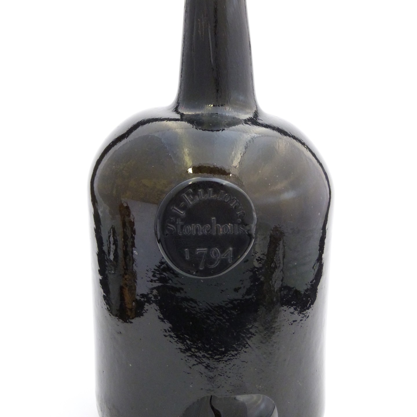 An 18Thc 'Black' Glass Mallet Shaped Wine Bottle With Seal. Sold For Ś800