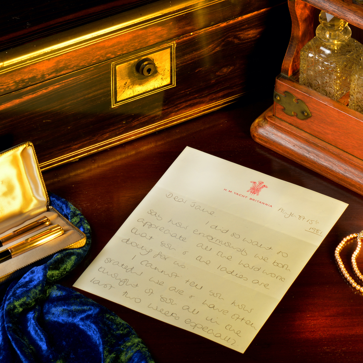 Desk of antique letterset, pens and ink bottles