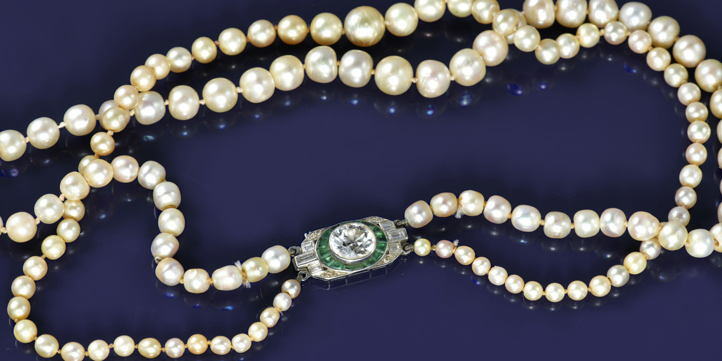 Natural pearl necklace with diamond and emerald clasp, sold for  £43,400