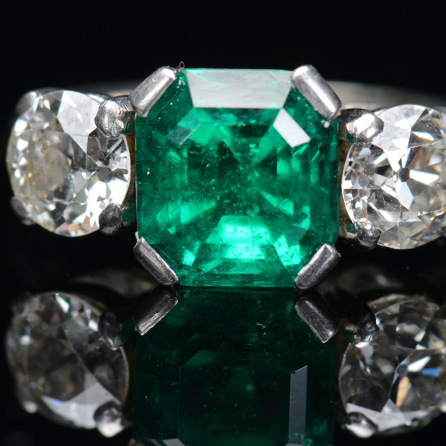 An 18Ct White Gold Ring Set With An Emerald And Diamonds. Sold For £5000